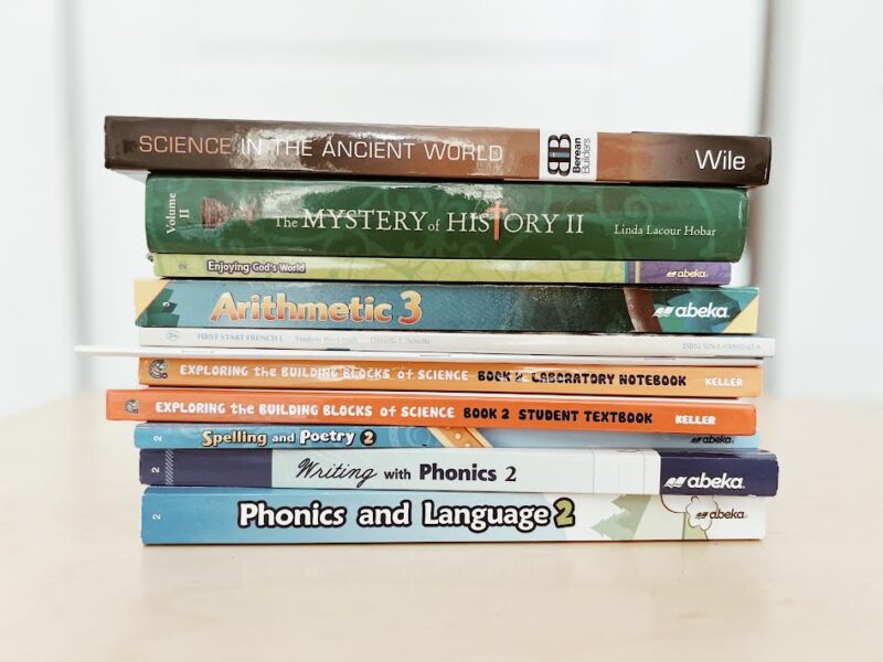 stack of second grade homeschool curriculum textbooks