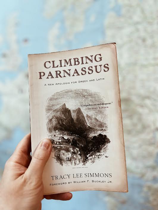 Climbing Parnassus book in front of map