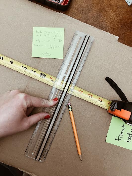 drawing lines to trace the body of the cello