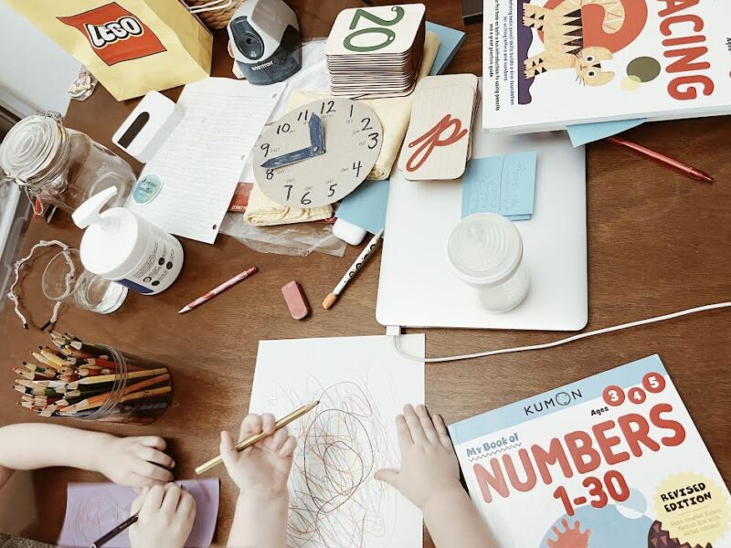 messy kitchen table of an overwhelmed homeschool mom