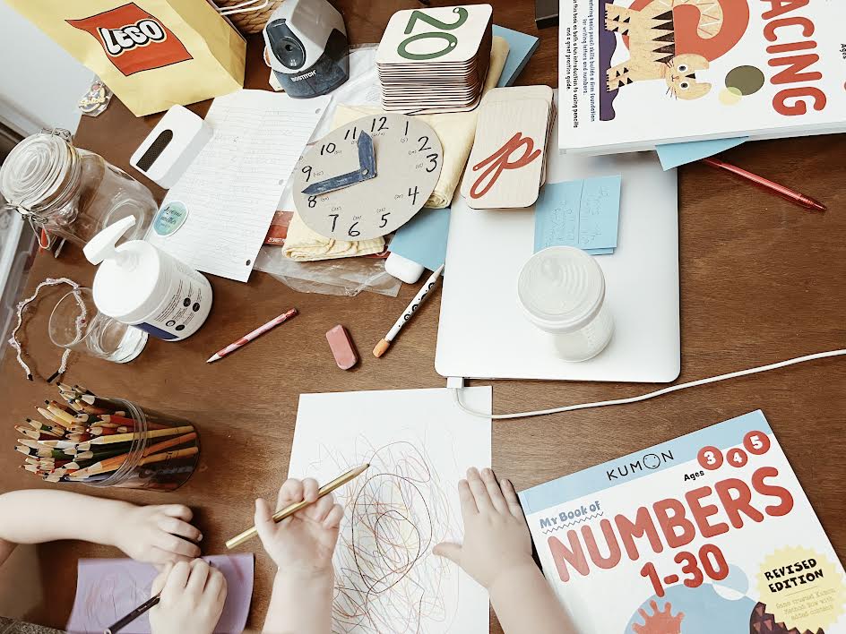 messy kitchen table of an overwhelmed homeschool mom