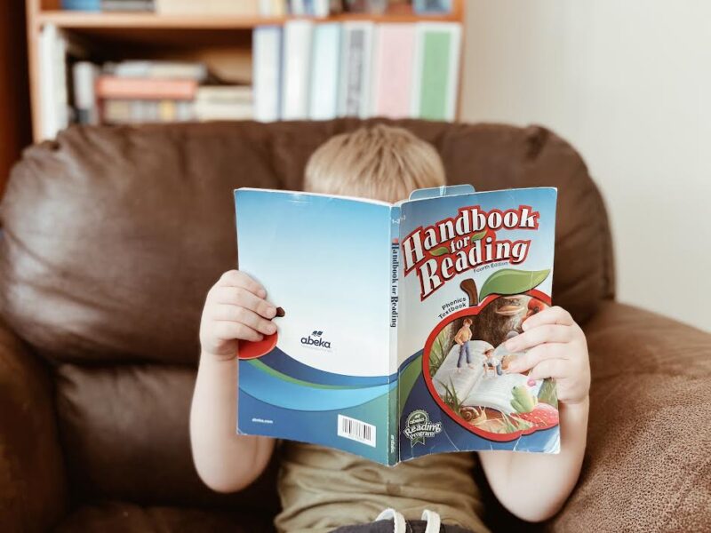 Preschooler reading Handbook for Reading