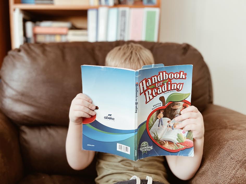 Preschooler reading Handbook for Reading