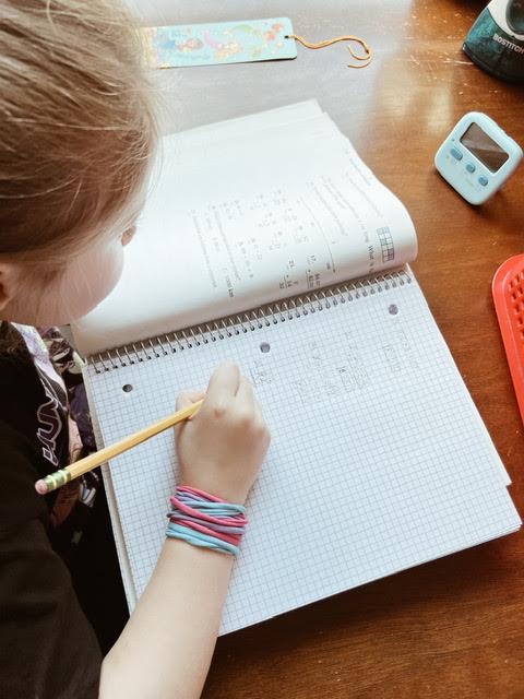 homeschool student at desk working on math homework