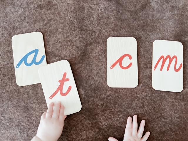 kid pointing to letters