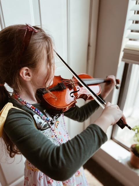 student practicing music independently