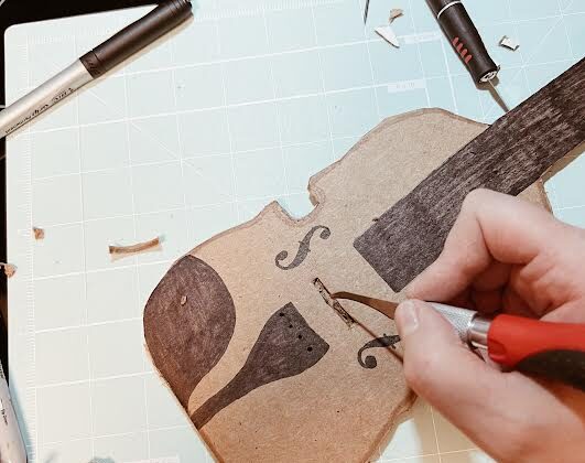 cutting out space for bridge of diy cardboard viola