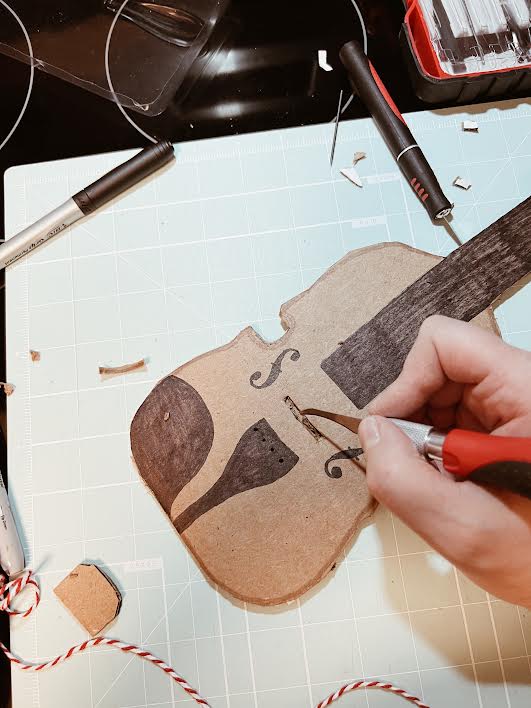 cutting out space for bridge of diy cardboard viola