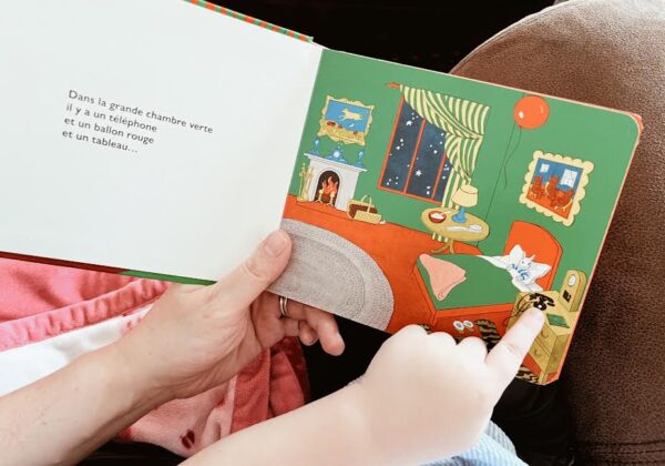reading French book with kid